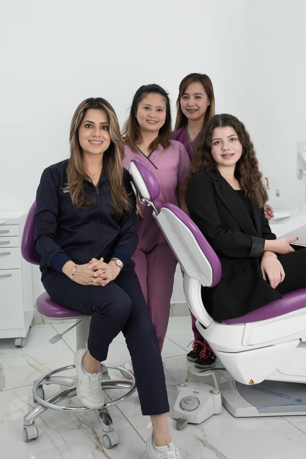 Dr. Fiza Quadri with a patient and members of her dental care team in Kuwait